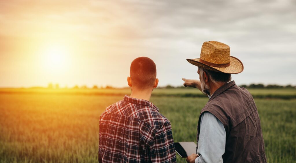 2 men surveying field