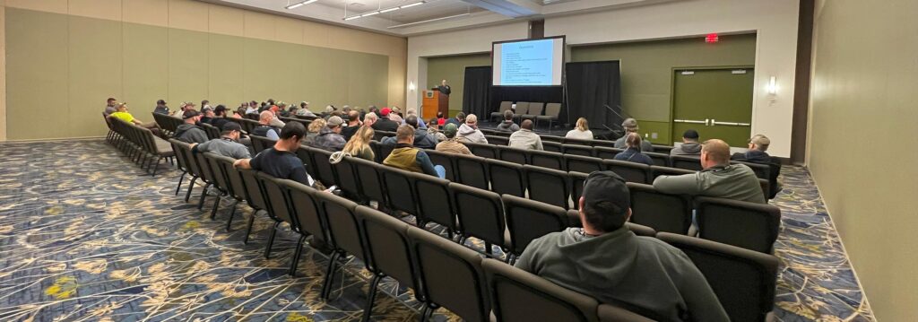 audience watching keynote speaker